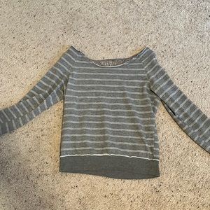 A grey long sleeve size Medium